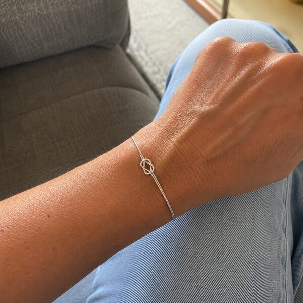 Customer wrist photo wearing the Amora Knot bracelet