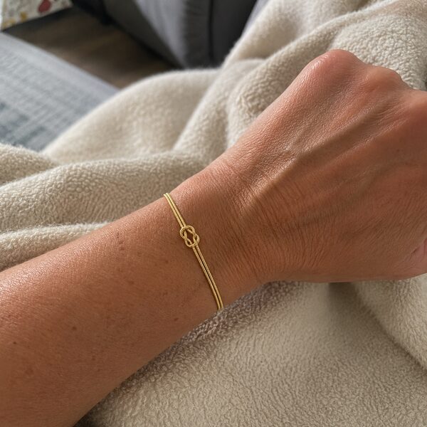 Close up of the Amora Knot on the wrist